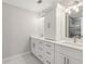 Elegant bathroom with double vanity, large mirror, and upgraded fixtures at 115 N Devereux Nw Ct, Atlanta, GA 30327