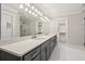 Elegant bathroom with double vanity and quartz countertop at 115 N Devereux Nw Ct, Atlanta, GA 30327