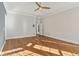 Sunlit bedroom featuring hardwood floors and ample space at 115 N Devereux Nw Ct, Atlanta, GA 30327