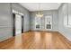 Elegant dining room with hardwood floors and gray walls at 115 N Devereux Nw Ct, Atlanta, GA 30327