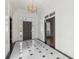 Bright entryway with marble flooring and chandelier at 115 N Devereux Nw Ct, Atlanta, GA 30327