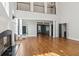 High ceiling living room with hardwood floors and view to foyer and staircase at 115 N Devereux Nw Ct, Atlanta, GA 30327