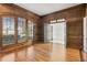 Wood paneled office with hardwood floors and large windows at 115 N Devereux Nw Ct, Atlanta, GA 30327