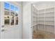 Bright walk-in pantry with ample shelving at 115 N Devereux Nw Ct, Atlanta, GA 30327