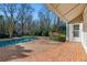 Inviting brick patio area with refreshing pool at 115 N Devereux Nw Ct, Atlanta, GA 30327