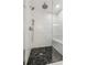 Spa-like shower with marble tile and built-in seat at 115 N Devereux Nw Ct, Atlanta, GA 30327