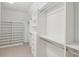 Large walk-in closet with ample shelving and hanging space at 115 N Devereux Nw Ct, Atlanta, GA 30327