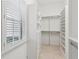 Large walk-in closet with ample shelving and hanging space at 115 N Devereux Nw Ct, Atlanta, GA 30327