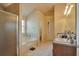 Bathroom with double vanity, soaking tub, and glass shower at 1491 Saint George Pl, Conyers, GA 30012