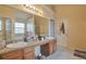 Bathroom features double sinks, a large mirror and plenty of counter space at 1491 Saint George Pl, Conyers, GA 30012