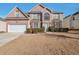 Brick two-story house with attached garage and manicured lawn at 1491 Saint George Pl, Conyers, GA 30012