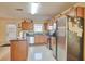 Kitchen with stainless steel appliances and wood cabinets at 1491 Saint George Pl, Conyers, GA 30012