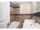 Clean bathroom featuring wood-look tile, a bathtub, and a modern vanity at 2681 Plantation Dr, Atlanta, GA 30344