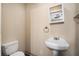 Small bathroom with pedestal sink and toilet at 2681 Plantation Dr, Atlanta, GA 30344