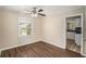 Simple bedroom with wood-look floors and access to kitchen at 2681 Plantation Dr, Atlanta, GA 30344