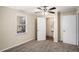 Bright bedroom with carpet flooring, a window, and access to a small bathroom at 2681 Plantation Dr, Atlanta, GA 30344