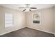 Bedroom with carpet, built-in shelves, and window at 2681 Plantation Dr, Atlanta, GA 30344