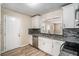 Modern kitchen with white cabinets and granite countertops at 2681 Plantation Dr, Atlanta, GA 30344