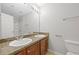 Double vanity bathroom with granite countertop and wood cabinets at 4660 Lake Hill Trl, Ellenwood, GA 30294