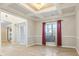 Bright dining room featuring hardwood floors and a tray ceiling at 4660 Lake Hill Trl, Ellenwood, GA 30294