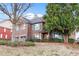 Two-story home with brick facade and lush landscaping at 4660 Lake Hill Trl, Ellenwood, GA 30294