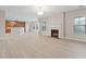 Open living room with fireplace and hardwood floors at 4660 Lake Hill Trl, Ellenwood, GA 30294