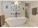 Bathroom featuring a freestanding bathtub and walk-in shower at 2972 Lookout Ne Pl, Atlanta, GA 30305