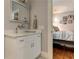 White vanity with a quartz countertop and a large mirror at 2972 Lookout Ne Pl, Atlanta, GA 30305