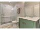 Updated bathroom with a walk-in shower and stylish green vanity at 2972 Lookout Ne Pl, Atlanta, GA 30305