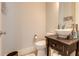 Small bathroom with a modern vessel sink and dark vanity at 2972 Lookout Ne Pl, Atlanta, GA 30305