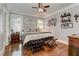 Cozy bedroom with hardwood floors, plenty of natural light, and decorative shelving at 2972 Lookout Ne Pl, Atlanta, GA 30305