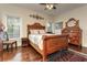 Bedroom with a wooden bed frame and ceiling fan at 2972 Lookout Ne Pl, Atlanta, GA 30305