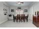 Elegant dining area with a glass-top table and hardwood chairs at 2972 Lookout Ne Pl, Atlanta, GA 30305