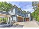 Modern two-story home with attached garage and a driveway at 2972 Lookout Ne Pl, Atlanta, GA 30305