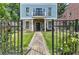 Elegant front entrance with a walkway and black door, framed by stone and columns at 2972 Lookout Ne Pl, Atlanta, GA 30305