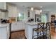 Open kitchen with white cabinets, quartz countertops, and stainless steel appliances at 2972 Lookout Ne Pl, Atlanta, GA 30305