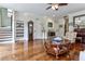 Living room with hardwood floors, built-in shelving and large windows at 2972 Lookout Ne Pl, Atlanta, GA 30305