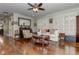 Hardwood floor living room with comfy seating and a large window at 2972 Lookout Ne Pl, Atlanta, GA 30305