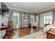 Main bedroom with hardwood floors, large windows and a rocking chair at 2972 Lookout Ne Pl, Atlanta, GA 30305