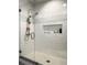 Walk-in shower with white subway tile and glass enclosure at 2972 Lookout Ne Pl, Atlanta, GA 30305