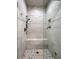 Walk-in shower with marble tile and built-in niche at 2972 Lookout Ne Pl, Atlanta, GA 30305