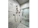 Walk-in shower with marble tile and built-in bench at 2972 Lookout Ne Pl, Atlanta, GA 30305