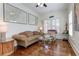 Bright sitting room with hardwood floors, plantation shutters and built-in shelving at 2972 Lookout Ne Pl, Atlanta, GA 30305