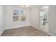 Simple dining area with hardwood floors and a view into the kitchen at 3530 Kingsbrooke Ct, Decatur, GA 30034