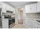 Kitchen with white cabinets, granite countertops, and stainless steel appliances at 3530 Kingsbrooke Ct, Decatur, GA 30034