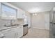 Kitchen features white cabinets, granite countertops and stainless steel appliances at 3530 Kingsbrooke Ct, Decatur, GA 30034