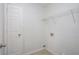 Laundry room with built-in shelving and a white door at 3530 Kingsbrooke Ct, Decatur, GA 30034