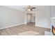 Open living room with hardwood floors and a view into the dining area at 3530 Kingsbrooke Ct, Decatur, GA 30034