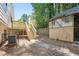 Backyard with deck, shed, and steps leading to the deck at 5879 Wellborn Trl, Lithonia, GA 30058