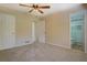 Bright bedroom featuring neutral walls and carpet, plus a private bathroom at 912 Northridge Nw Dr, Conyers, GA 30012